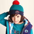 Beulah Shaun the Sheep Kids Knitted Beanie Pom Pom Hat - Peacock Green/Night Blue